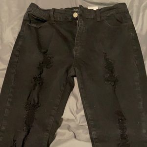 Black stretch jeans with holes